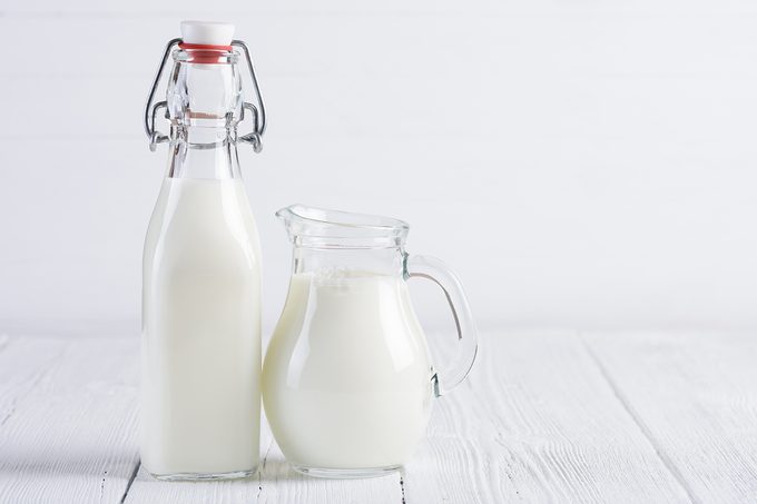Jar With Milk And Vintage Bottle Of Milk
