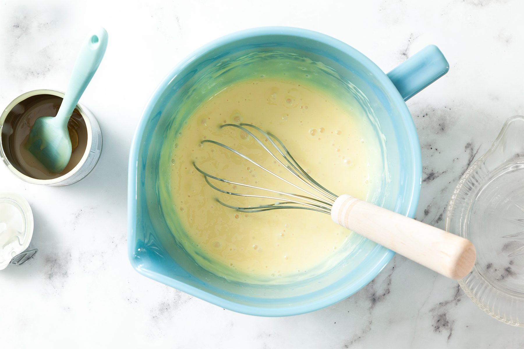 A bowl with whisk