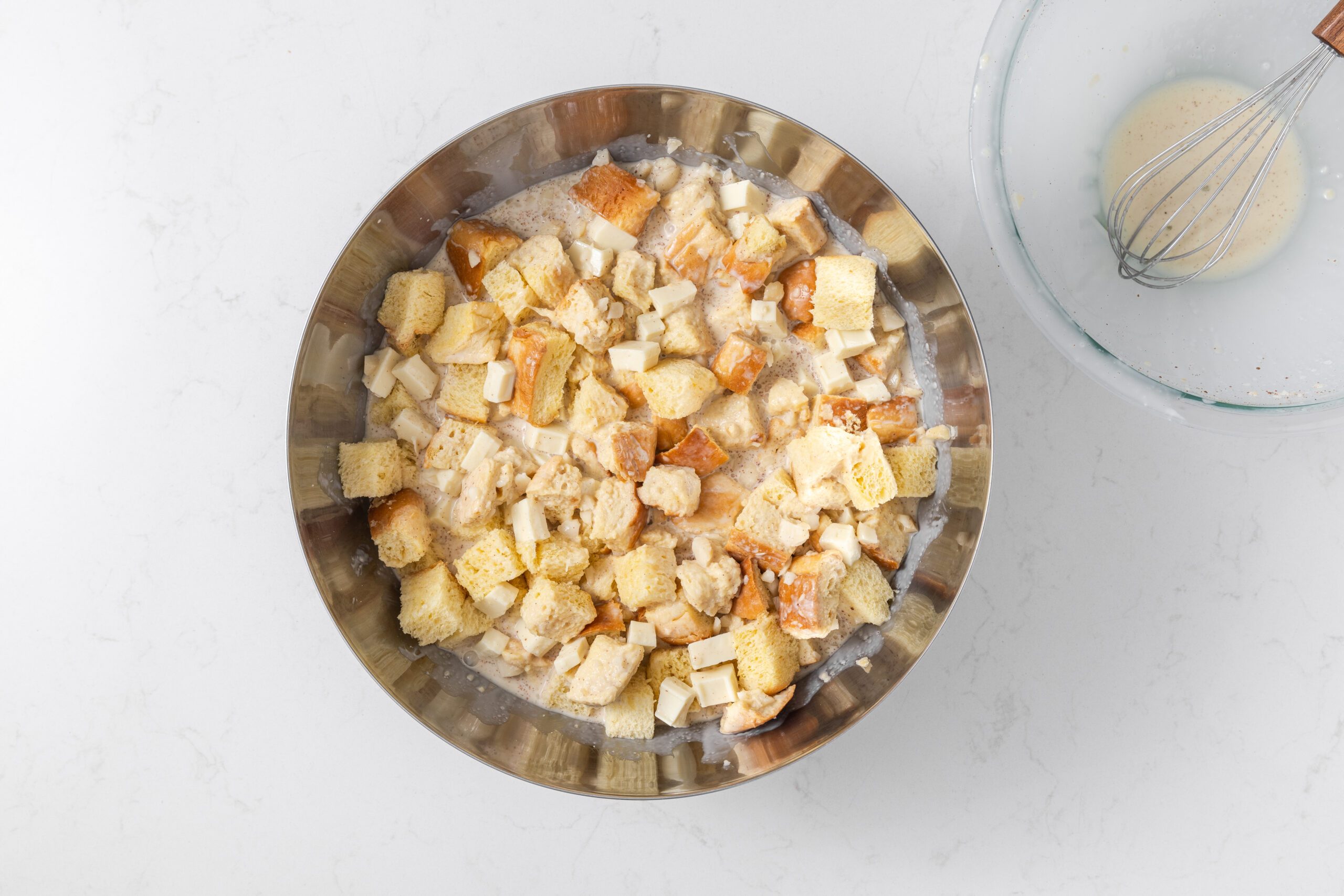 Bread pudding ingredients being mixed together.