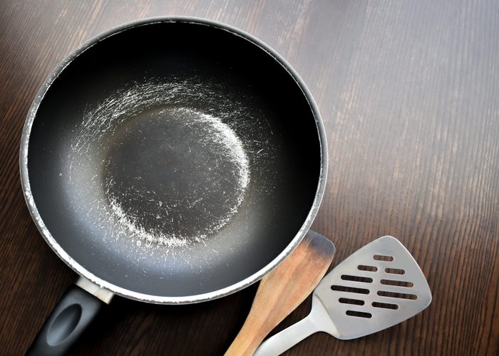 Old scratched non-stick saucepan.