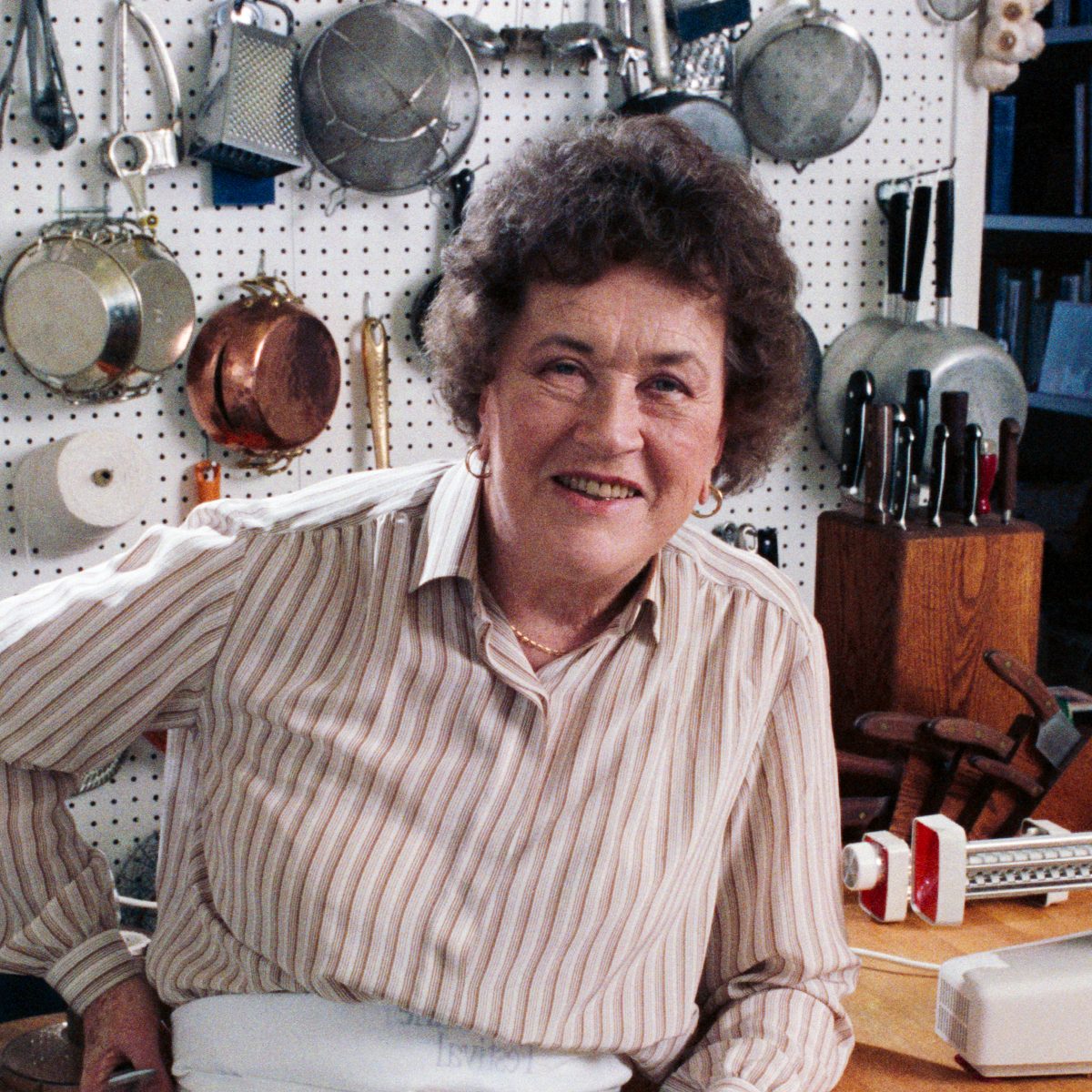 Julia Child Posing in her Kitchen